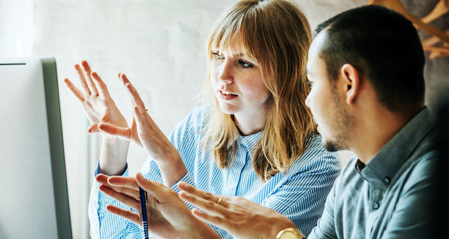 woman and man plan on computer