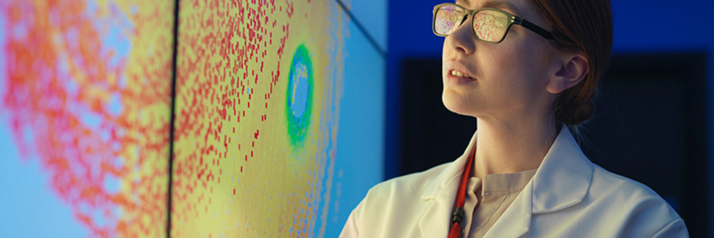 female analyst observing map