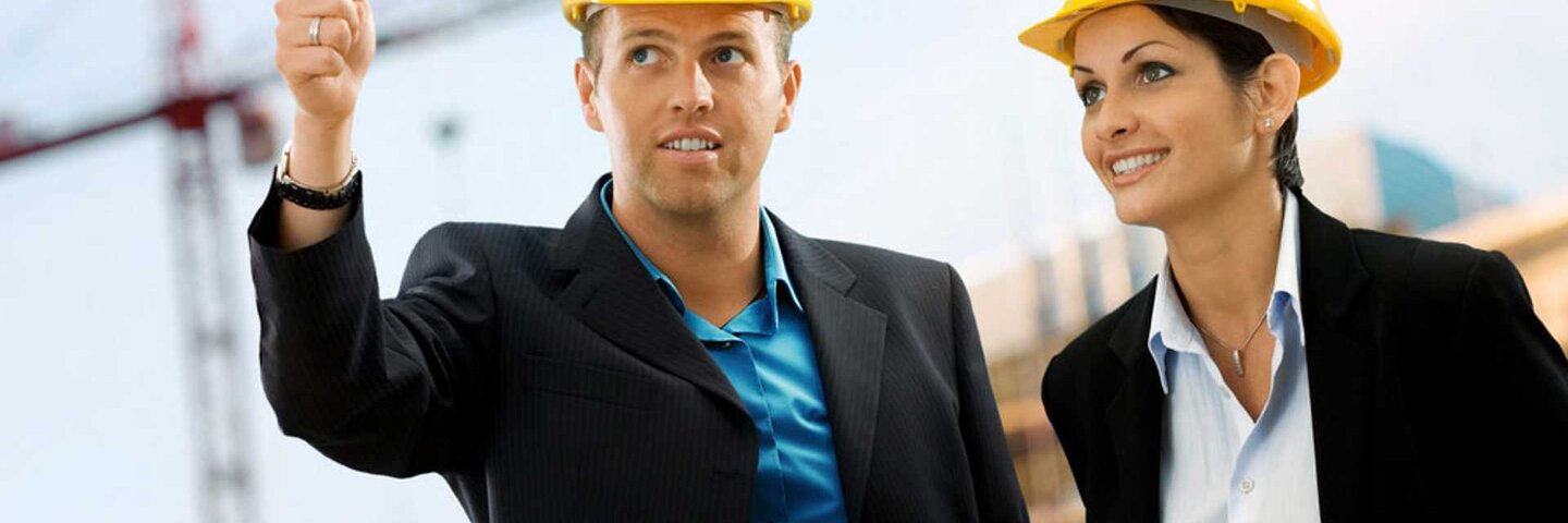 Construction site managers review a job site.