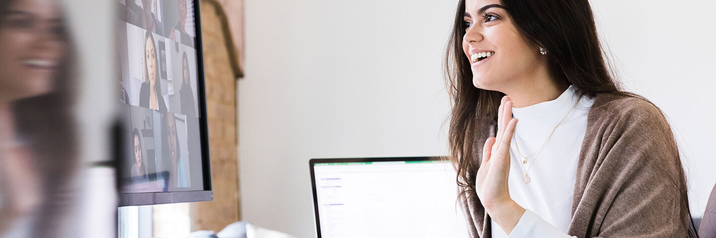 Woman enjoying a video conferencing on her desktop computer