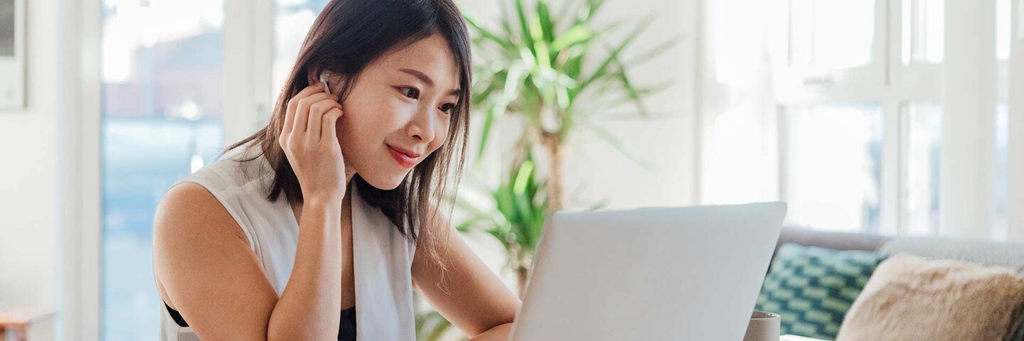 female looking at laptop computer