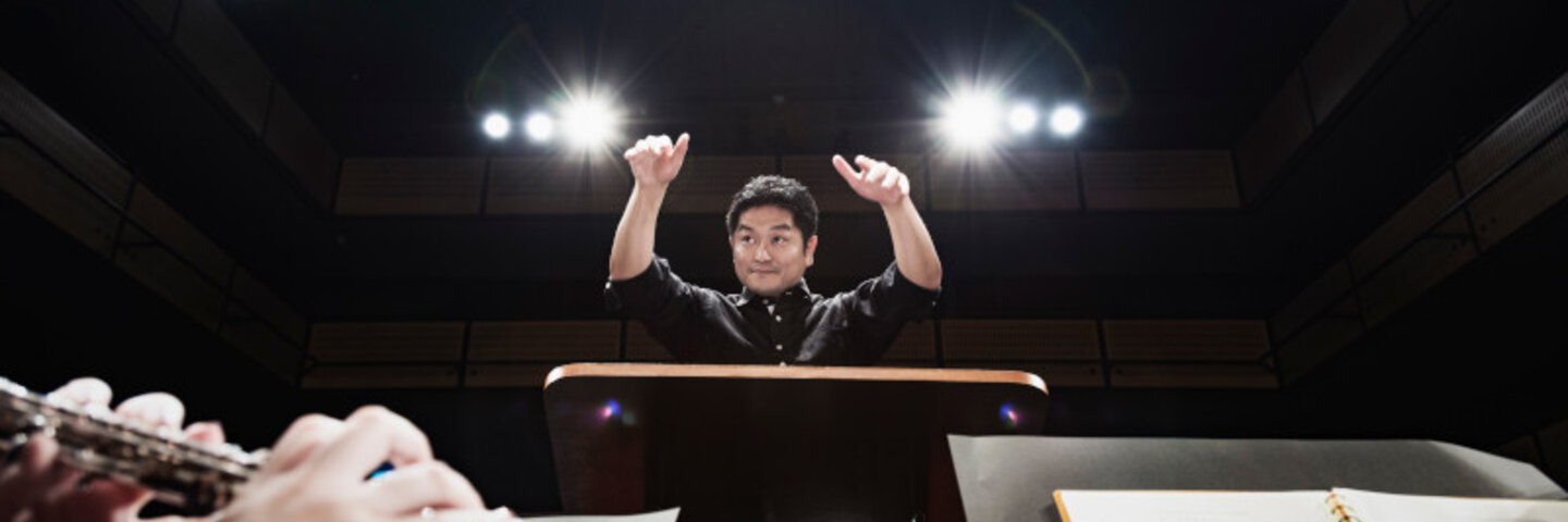Conductor in front of musicians