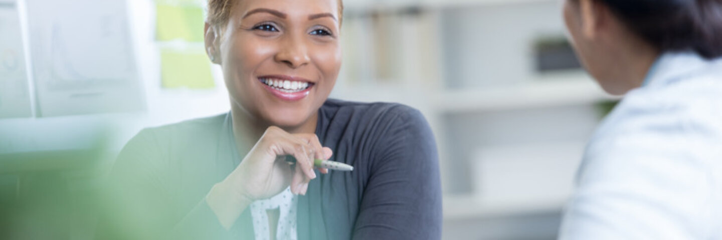 two female business professionals having a conversation