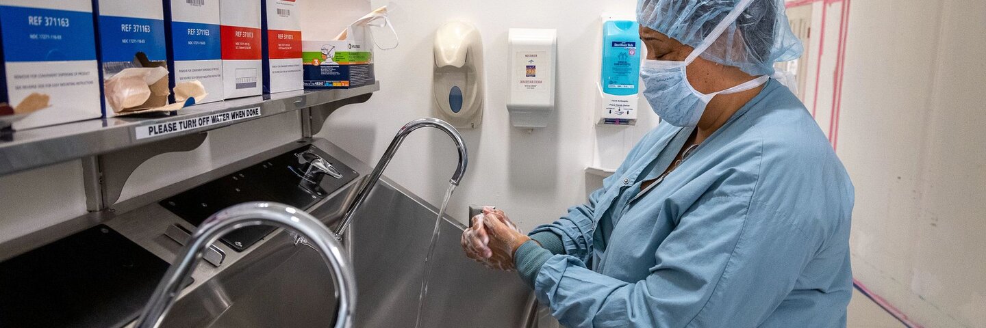 Healthcare worker washing hands