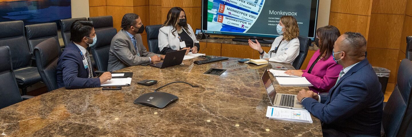 Doctor meeting on infection control in a board room