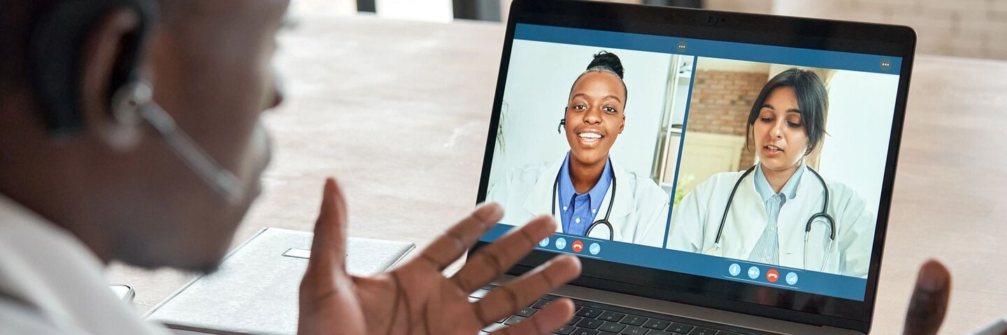 Multicultural doctors team conferencing in video call chat discussing health care learning online during web seminar.