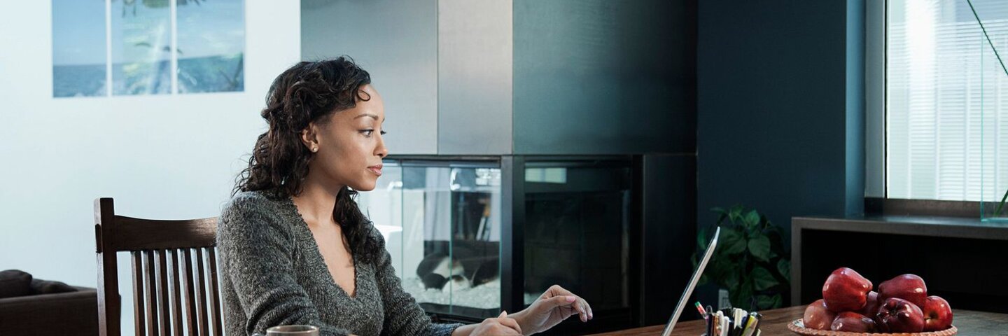 Woman working on personal finances at home
