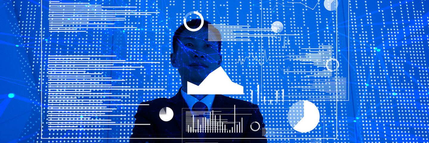 man standing looking at screen