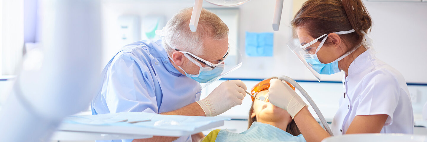 Dentists working on a patient