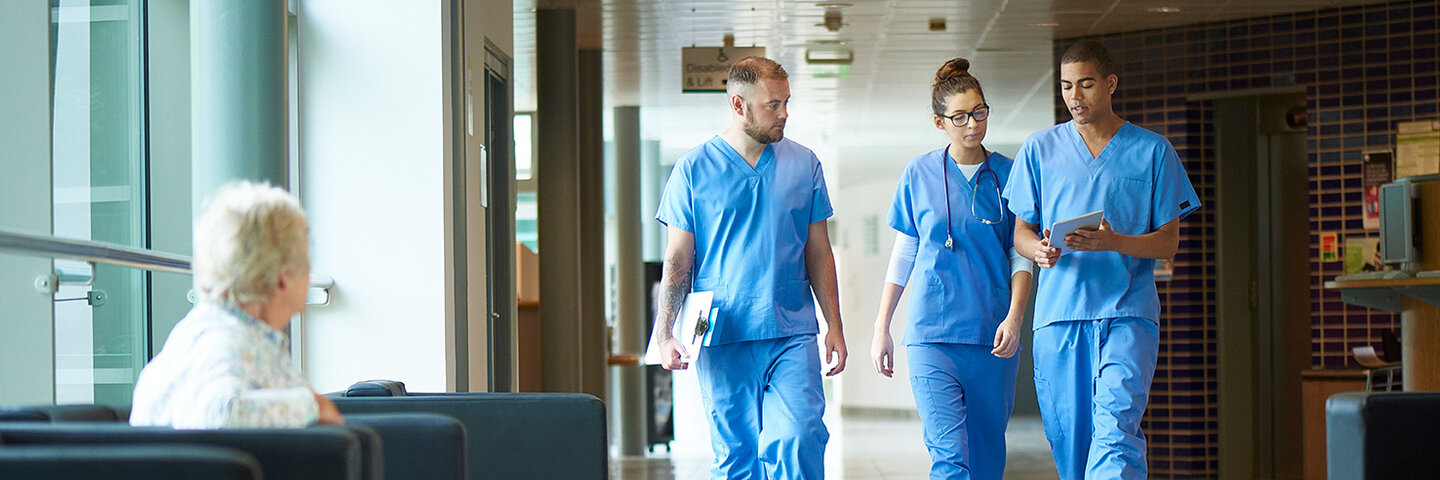 Physicians walking down hallway