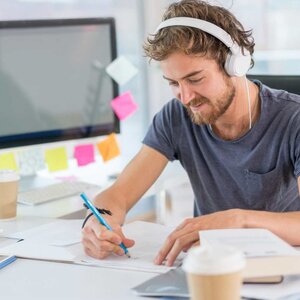 man sitting in front of computer