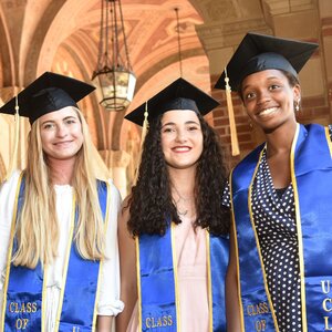 three smiling UCLA Extension graduates
